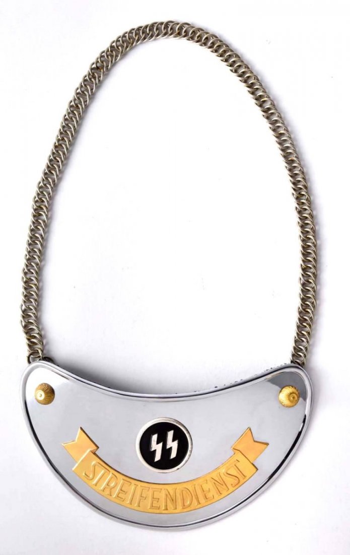 SS Gorget.: This beautiful all original Gorget is in near perfect condition. Brightly polished metal with gold plated accents. Has the SS logo in the center and original chain. Condition (Excellent - Near Mint).