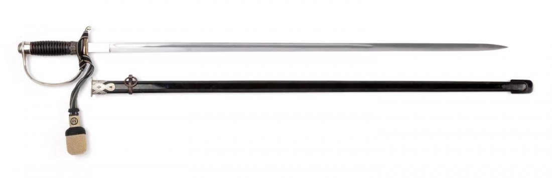 SS NCO Sword.: This rare sword features a 33" blade, not etched, 38" overall. Single fuller, leather washer, nickel plated D guard, wooden handle with serrations, metal scabbard black enamel, single hanger. decorati
