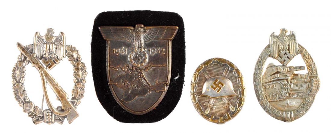 Lot of 4: German Badges.: To include: A panzer badge with rear stick pin, 2-1/4", excellent original condition. Second features a German helmet with swastika and crossed swords, in a period box, 1-3/4". Third, features an eagl