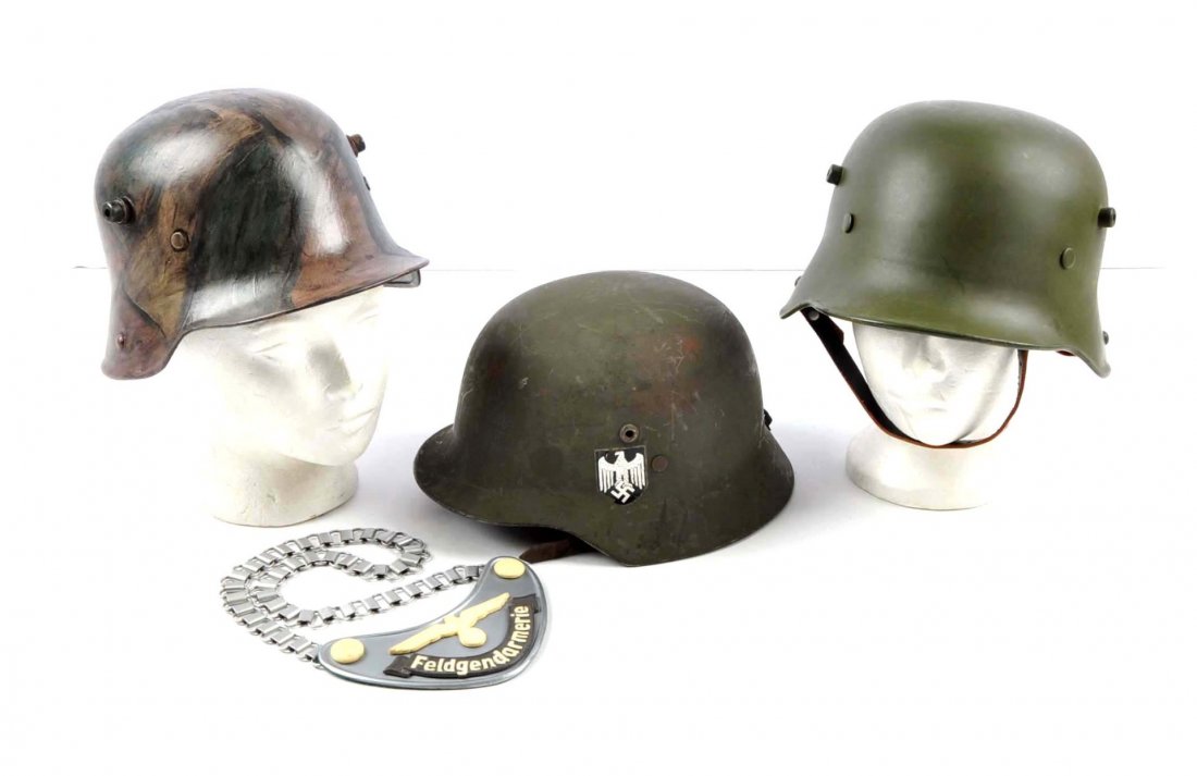 Lot Of 4: Replica Helmets & Gorget.: Lot contains two recently repainted WWI German helmets, one Finnish WWII helmet with reproduction decals and one reproduction field police gorget.