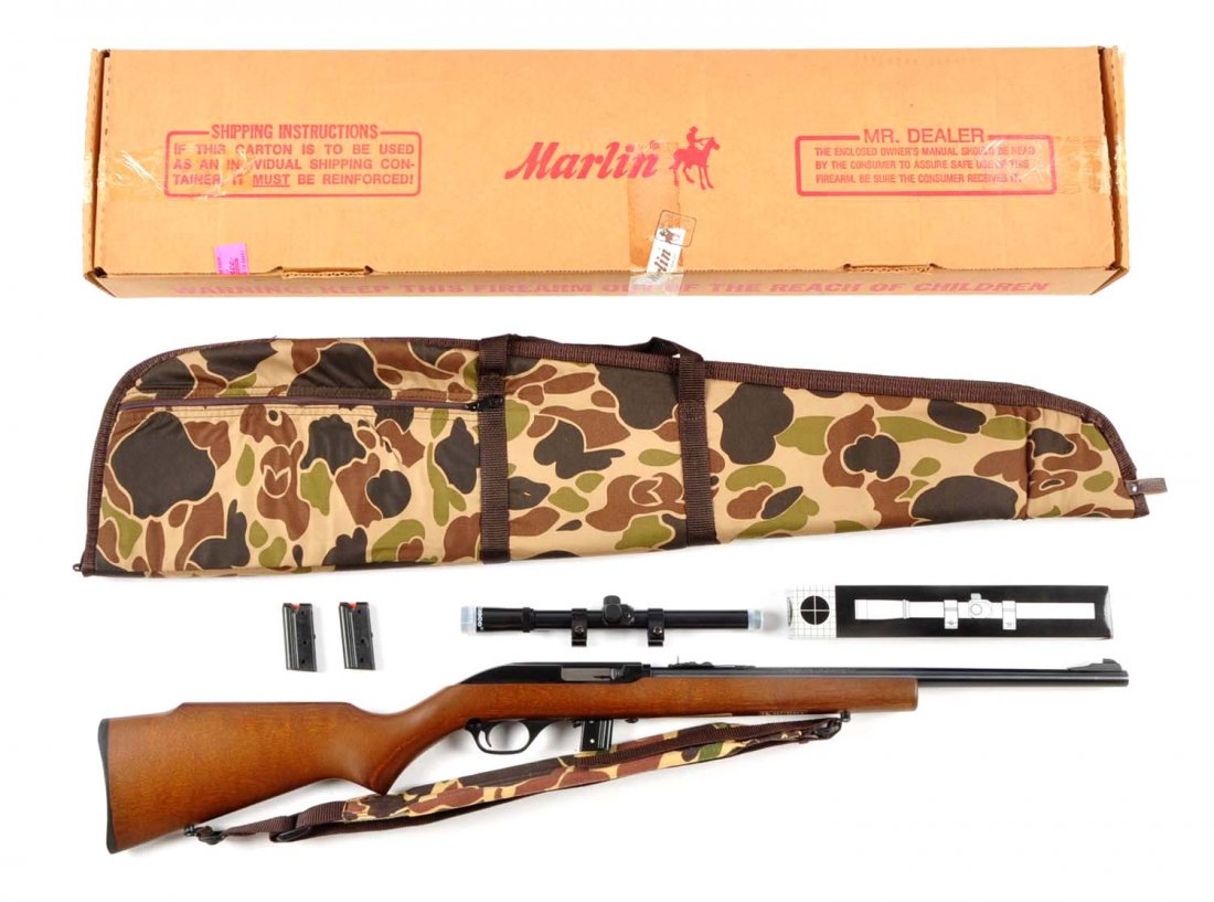 (M) MIB Marlin Model 70 Semi-Automatic Carbine.: Serial # 08343840 18" barrel in .22 LR caliber. Features a Monte Carlo-style walnut finished hardwood stock. The 18" blued barrel is fixed to the receiver and uses Micro-Groove rifling. The 70 has a c