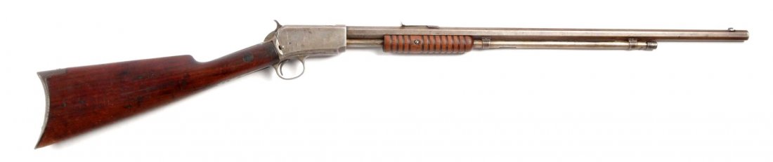 (C) Winchester Model 1890 Pump Rifle.: Serial # 117454 24" barrel in .22 short caliber. Manufactured in 1901. Has sharp legends and is brown patina. Forearm has a repaired crack. Stock has numerous cracks and is shy to metal. Features octa