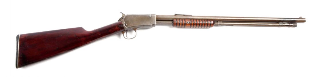 (C) Winchester Model 1906 Pump Rifle.: Serial # 584828 20" barrel in .22 rimfire caliber. Manufactured in 1919. Features tube fed magazine, takedown, walnut stocks, straight buttplate with blued finish, and original sporting front and rear