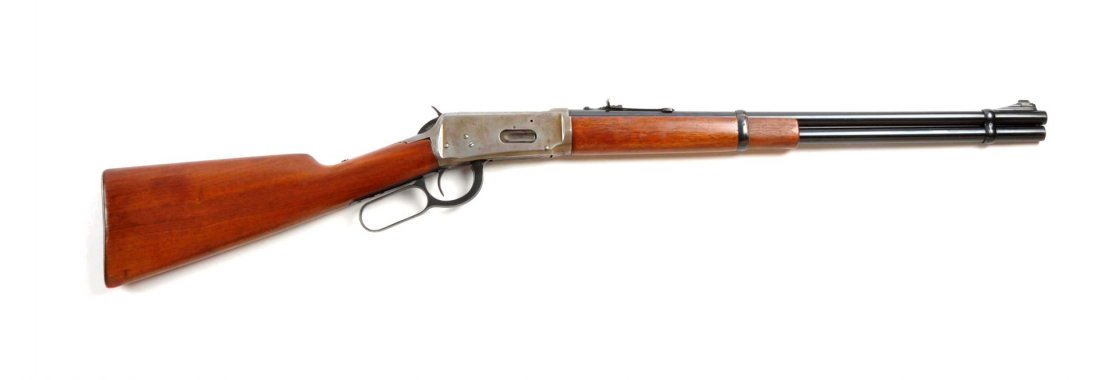 (C) Winchester Model 1894 Carbine.: Serial # 1657977 20" barrel in .30-30 caliber. Manufactured 1949. No saddle ring or stud. Features long wood forend, walnut stocks, ramp front sight, sporting rear sight, and checkered steel shotgun b