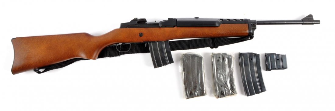 (M) Ruger Mini-14 Rifle.: Serial # 188-05736 18-1/2" barrel in .223 caliber. Features military matte finish, composite ventilated handguard, adjustable rear sight, hardwood stock, sling swivels, carbine buttplate, magazine fed