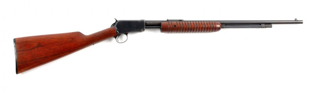 (C) Winchester Model 62 Slide Action Rifle.: Serial # 184106 .22 rimfire caliber with a 23" barrel. Manufactured 1947. Standard hammer model takedown .22 caliber pump action rifle with full round barrel, 2/3 magazine and tube, blued finish, spor