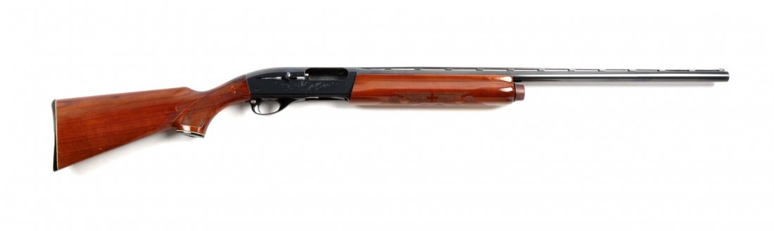 (M) Remington 1100 Semi-Automatic Shotgun.: Serial # M016818V 28" barrel in 12 bore. Features 2-3/4" chamber, modified choke, full vent rib, single bead sight, blued finish, high gloss press checkered walnut stock with pistol grip. The composit