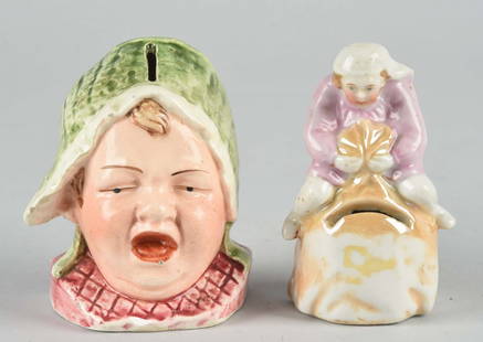 Lot Of 2: Pottery Banks.: Includes crying child and child on sack. Broken out base on crying child. Condition (Very Good). Size Largest: 3-1/2" T.