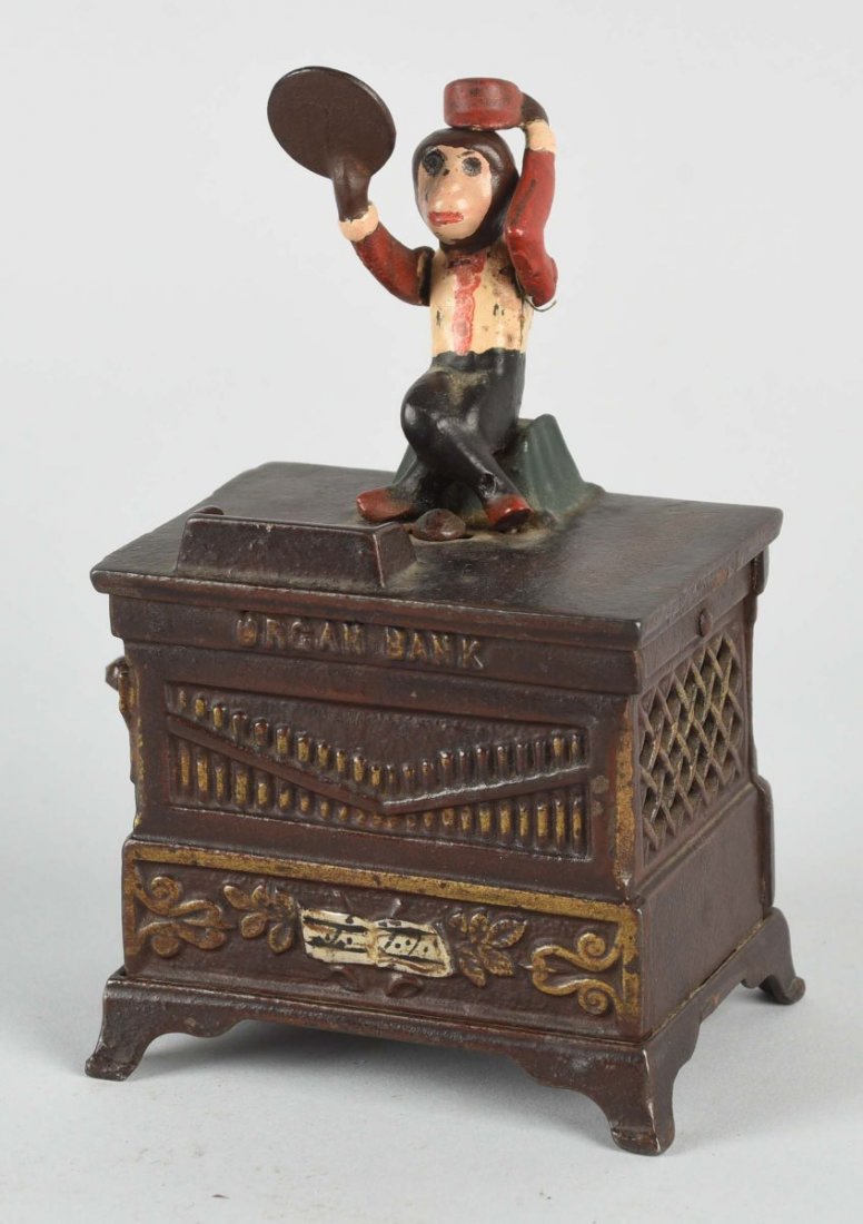 Cast Iron Organ Bank.: Manufactured by Kaiser & Rex. Working condition. Repaint to monkey. Condition (Very Good). Size 6-1/2'' T.