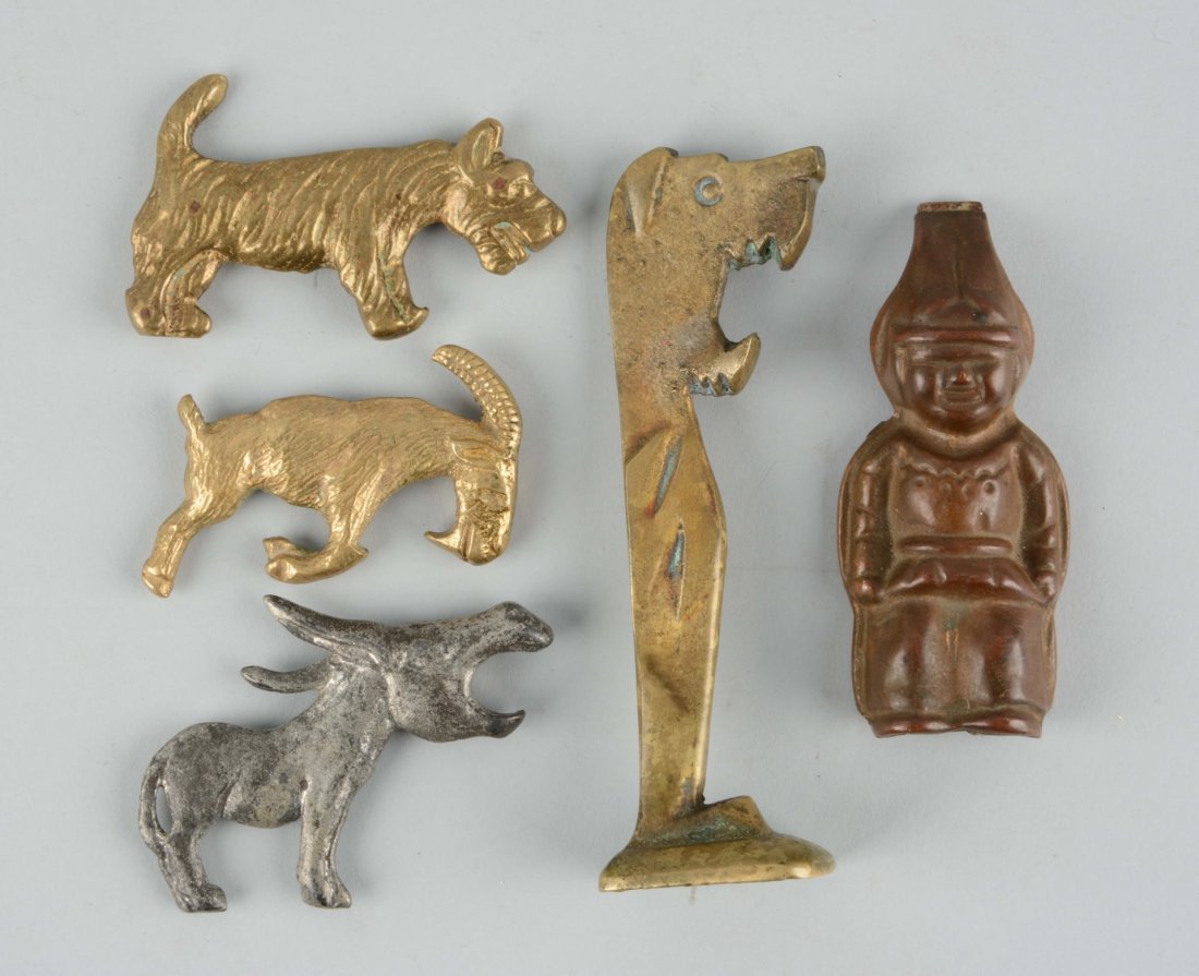 Lot of 4: Cast Iron Figural Bottle Openers. (1 of 1)