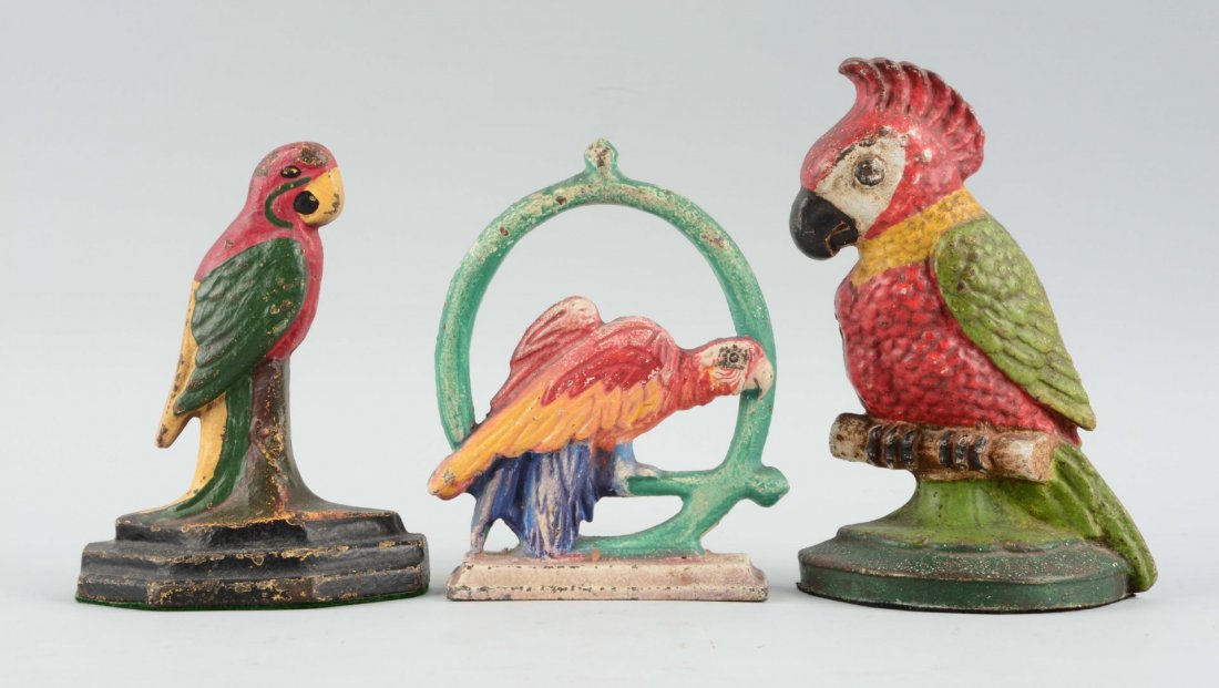 Lot of 3: Cast Iron Parrot Doorstops.: Hubley, Albany Foundry, etc. One has touch up to paint. Condition (Good). Size Largest: 8-1/2'' T.