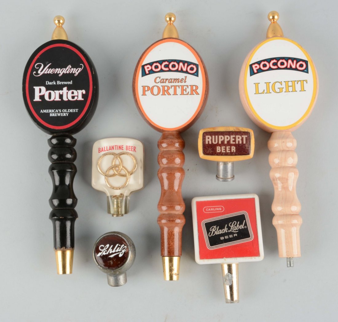 Lot Of 7: Assorted Beer Taps.: Includes: Yuengling, Pocono, Baltimore Beer, Ruppert, Schlitz and Black Label. All have wear. Condition (Good - Very Good). Size Largest: 11-1/2'' L.
