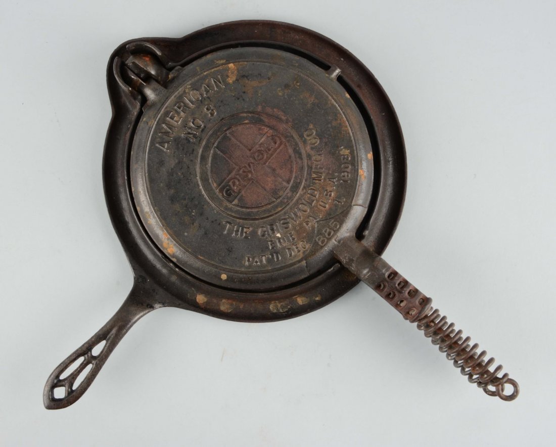 Griswold No. 8 Cast Iron Waffle Iron.: Condition (Excellent). Size 17'' L.