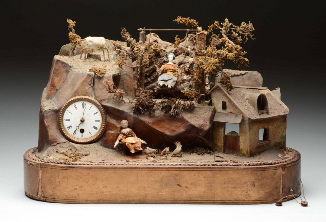 French Automated Diorama Musical Clock.: French clock with porcelain dial, not working. Small porcelain doll on swing. Small seated bisque doll (rough), papier-mâché deer on mountain missing head. Small cylinder music box with comb teeth i