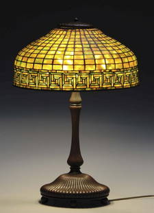 Tiffany Studios 16" Greek Key Lamp.: The leaded shade on a Tiffany Ribbed Mushroom table base. 23" tall. Shade with Tiffany tags, base with Tiffany stampings. Original finial cap. Condition (Very Good - Excellent). Size 16'' Dia.