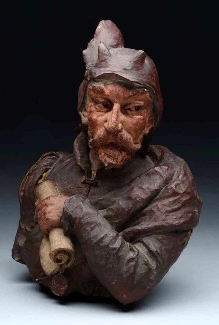 Figural Bust of Prime Designer for Teco Pottery.: This bust of a man was sculpted in a manner that lets the viewer see the intricacies of the entire bust. The bust depicts a gentleman in a reddish brown jacket with some yellow on the shoulder. His ha