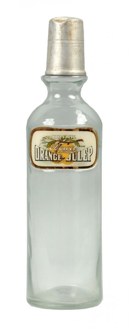 Howel's Orange Julep Soda Fountain Syrup Bottle.: Great soda fountain bottle with label under glass. Bottle has light wear and a small dent in the metal cap. Condition (Very Good). Size 12-1/2'' T.