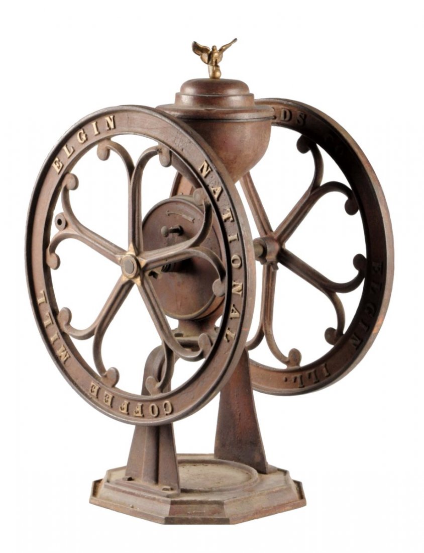 Woodruff & Edwards Co. Coffee Mill Elgin, Ill.: The unit does retain its original paint but does have moderate soiling and oxidation throughout. Both outside wheels do say "National Coffee Mill Elgin" and on the insides it says "Woodruff & Edwards 