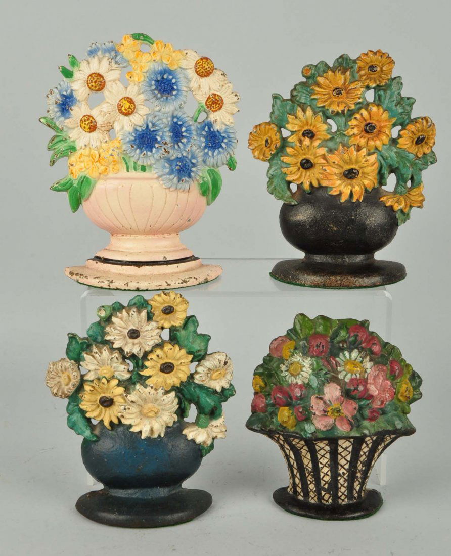 Lot of 4: Cast Iron Assorted Flower Doorstops.: Hubley, etc. One repainted.