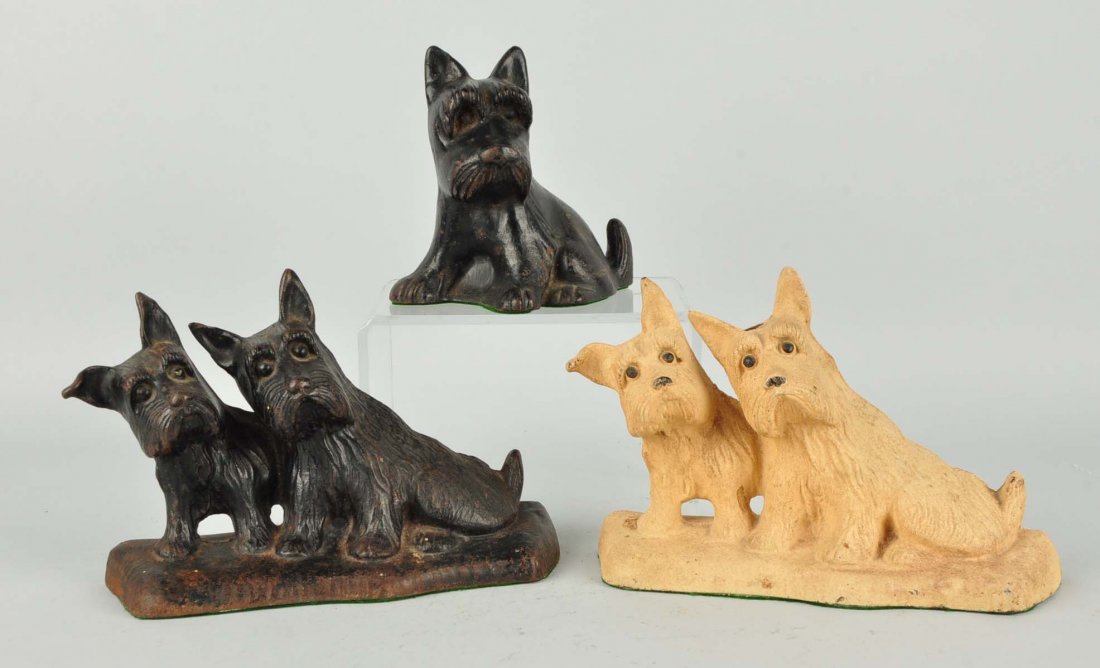 Lot of 3: Cast Iron Scottie Doorstops.: White twin Scottie is lamp base.