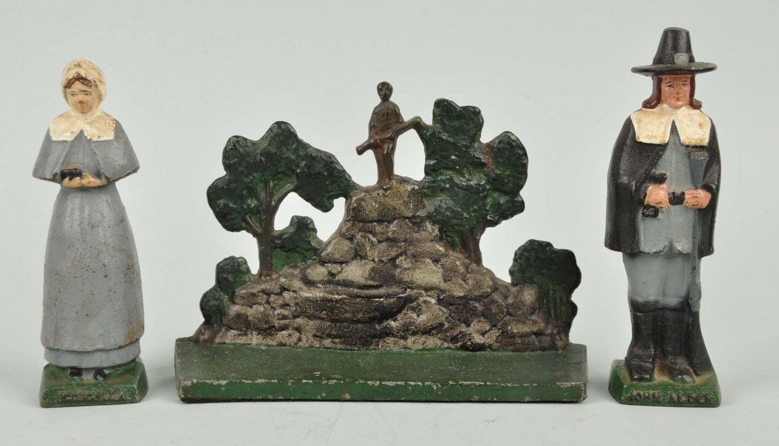 Lot Of 3: J.Alden, Priscilla & J. Parker Doorstops: Captain John Parker Monument doorstop; and Priscilla & John Alden bookends.