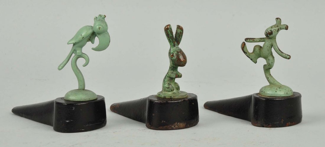 Lot of 3: Cast Iron Assorted Deco Wedge Doorstops. (1 of 1)