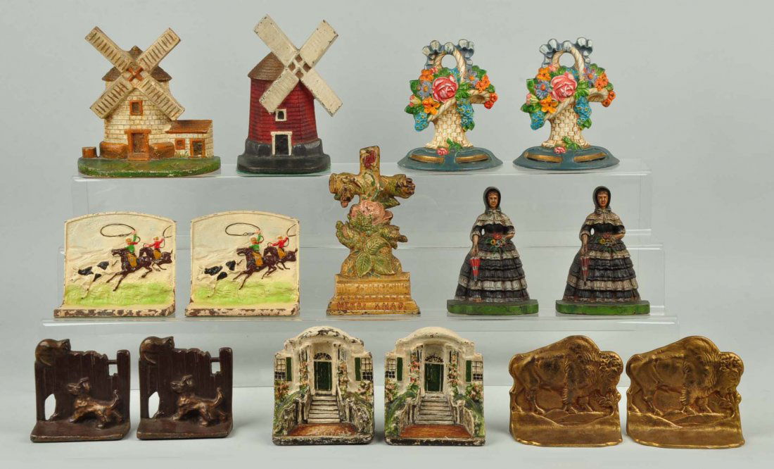 Lot of 6 pairs, 3 singles: Cast Iron Assorted Bookends: Includes two Windmill doorstops; Flower Basket, Cowboys, Lady in Hooped Skirt, etc. bookends.