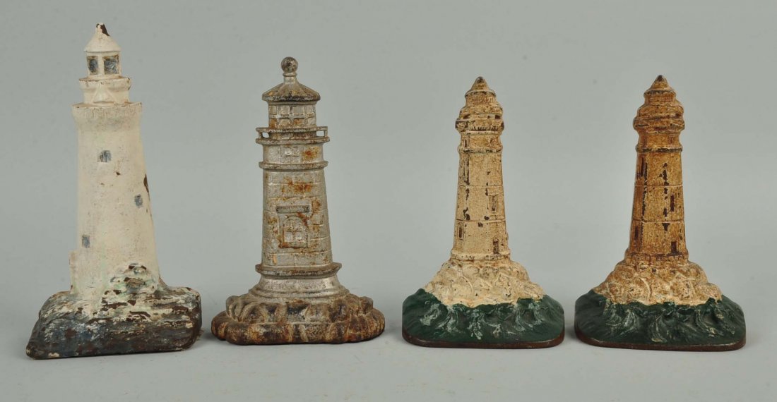 Lot of 4: Cast Iron Lighthouse Doorstops. (1 of 1)