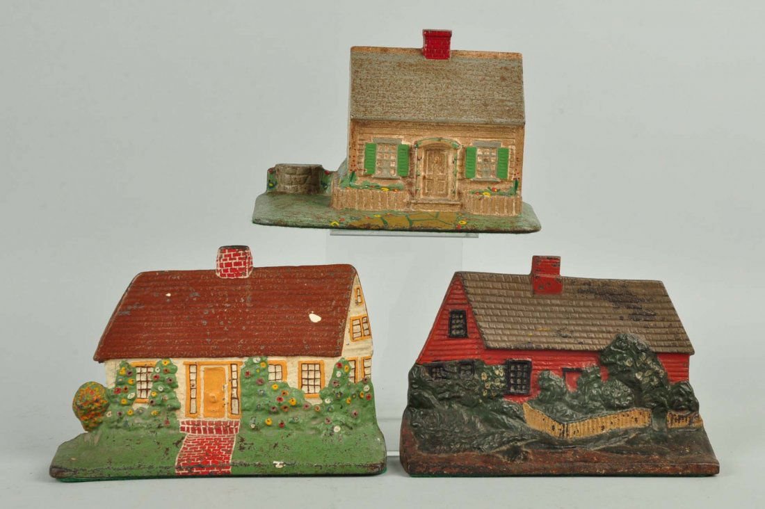 Lot of 3: Cast Iron Cottage Doorstops. (1 of 1)