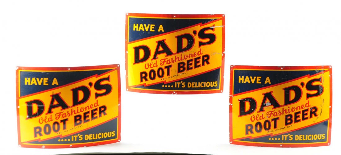 Lot of 3: Dad’s Root Beer Signs.: This lot consists of three signs for Dad’s Root Beer. The three curved signs are yellow, blue and red coloring. The three signs say: “Have A Dad’s Old Fashioned Root Beer…It’s Delicious.”