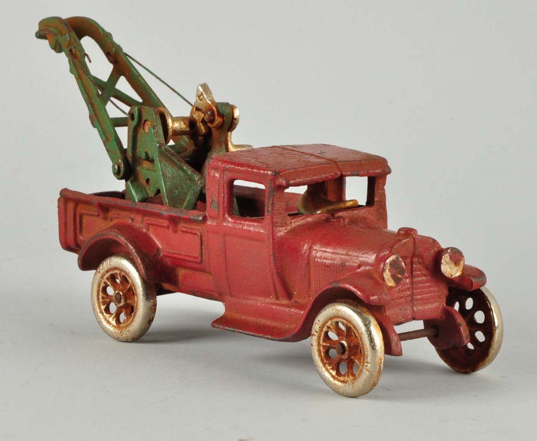 Cast Iron Ford Weaver Tow Truck.: Boom is broken, spots of repaint, marked "Arcade", scratches and paint chips.