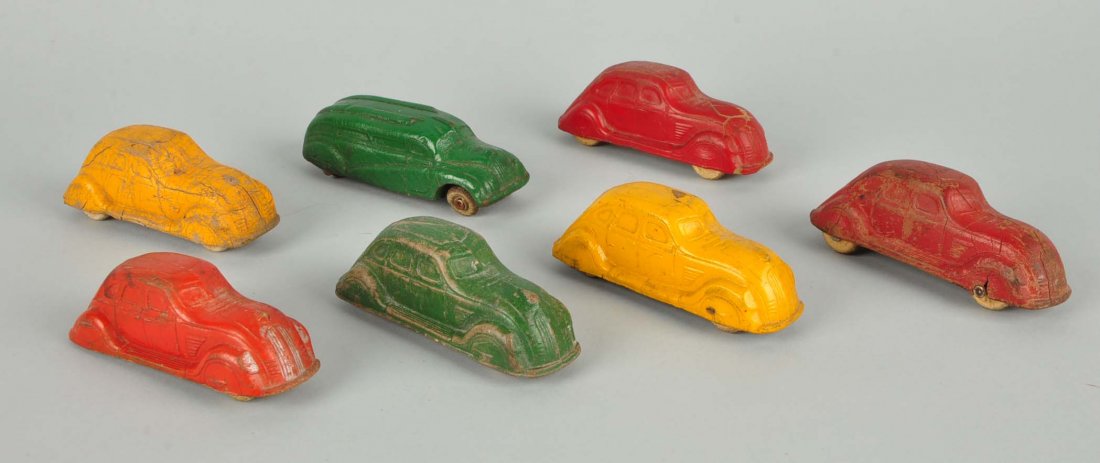 Lot Of 7: Sun Rubber Wooden Toy Cars.: All have scratched and worn paint. Green bus is missing a tire.