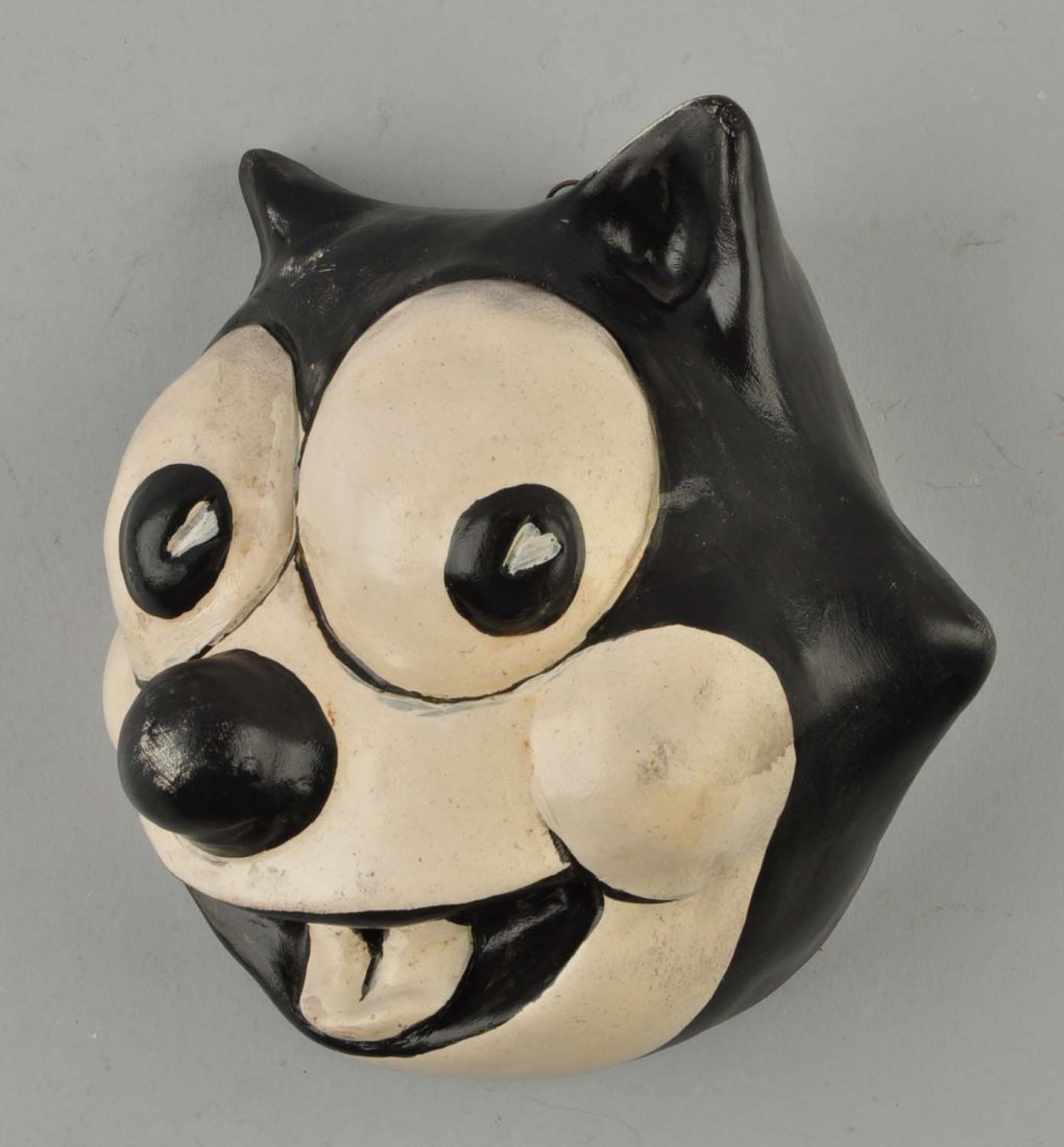 Felix String Holder.: Composition. Slight paint loss on the nose.