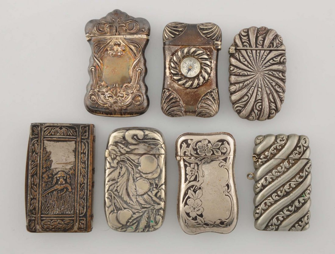 Lot Of 7: Vintage Match Safes.: Plated metal. Three are floral, one with a compass, a book and two Art Nouveau.