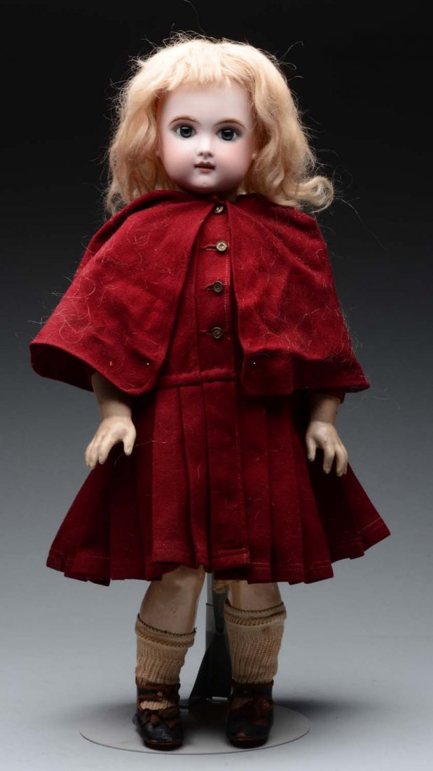 French Eden Bébé Doll.: Bisque socket head "Eden Bébé Paris" (hairline across forehead), multistroked eyebrows, mauve eyeshadow, blue paperweight eyes, lushly painted upper and lower lashes, open mouth with six upper teeth