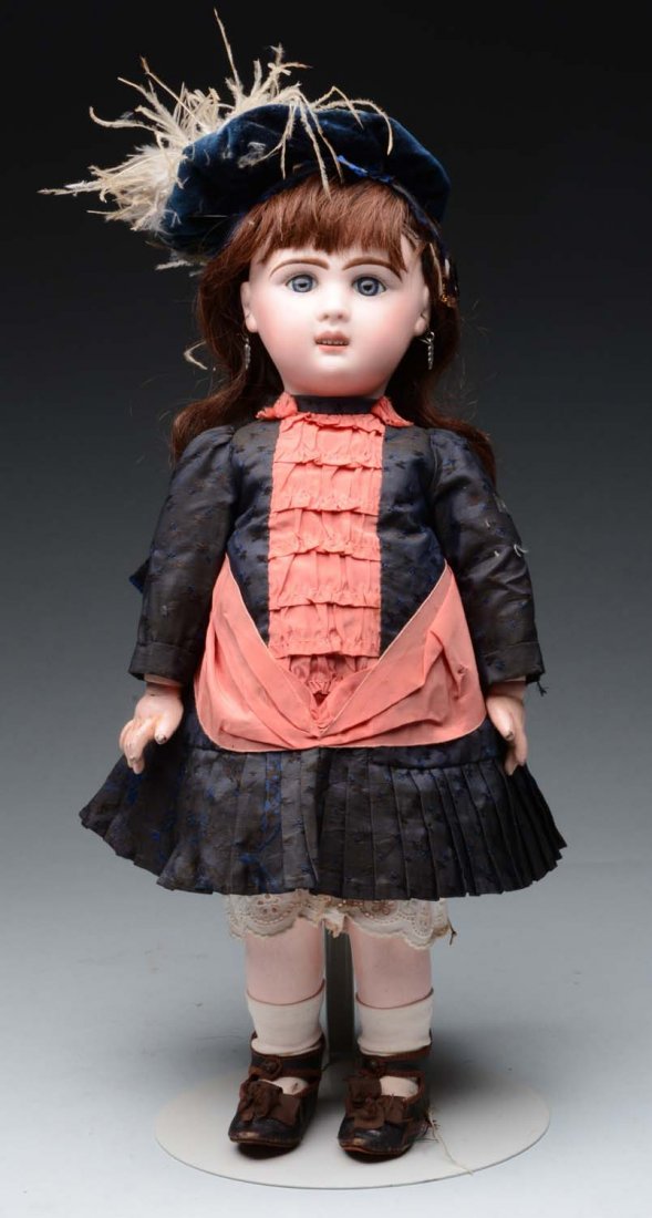 French Jumeau B.L. Bébé Doll.: French bisque socket head incised "B 7 L" with Jumeau checkmarks made for the Louvre Department Store (light hairline from forehead to eyebrow) with multistroked eyebrows, blue paperweight eyes with p