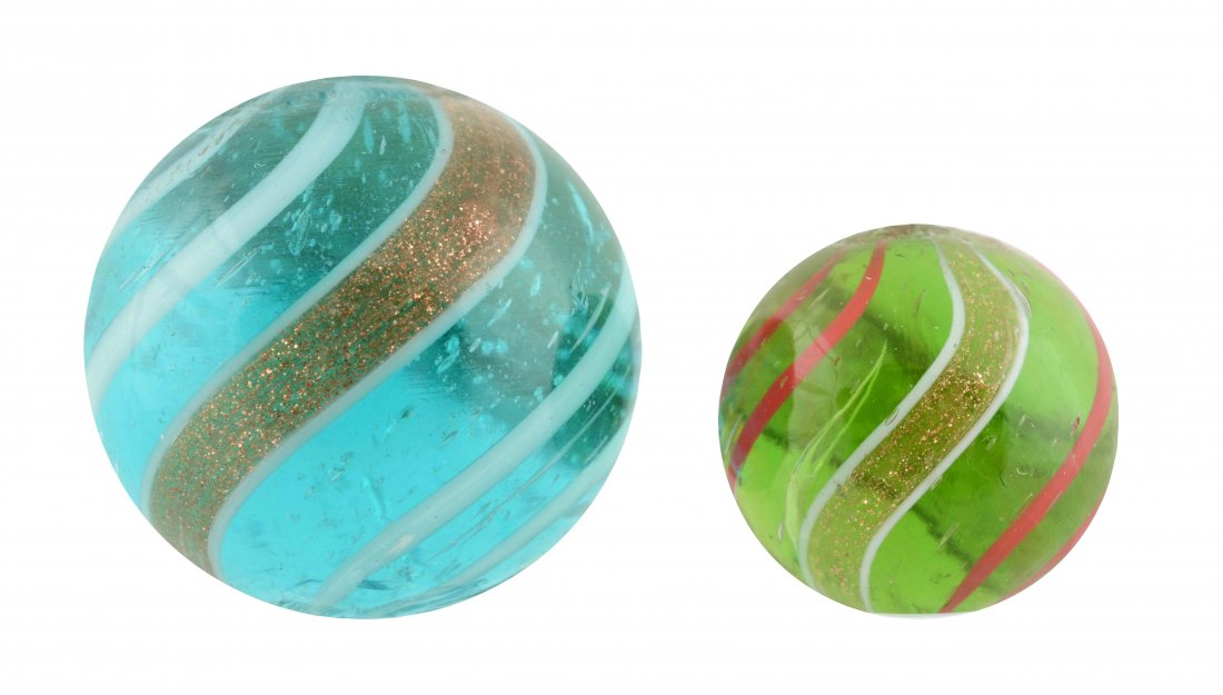 Lot Of 2: Banded Lutz Marbles.: The smaller is a green transparent base with red bands. The larger is an aqua transparent base with white bands. Both have a small chip near the top pontil. (8.9). 9/16'' to 25/32'' Dia.