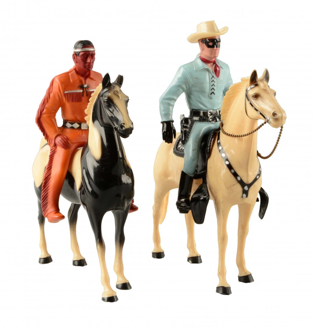 Lot Of 2: Hartland Plastic Lone Range & Tonto.: Both on horses. Includes some accessories: a hat, gun and a saddle. Some scratching and wear. (Very Good). Largest: 9-1/2'' T.