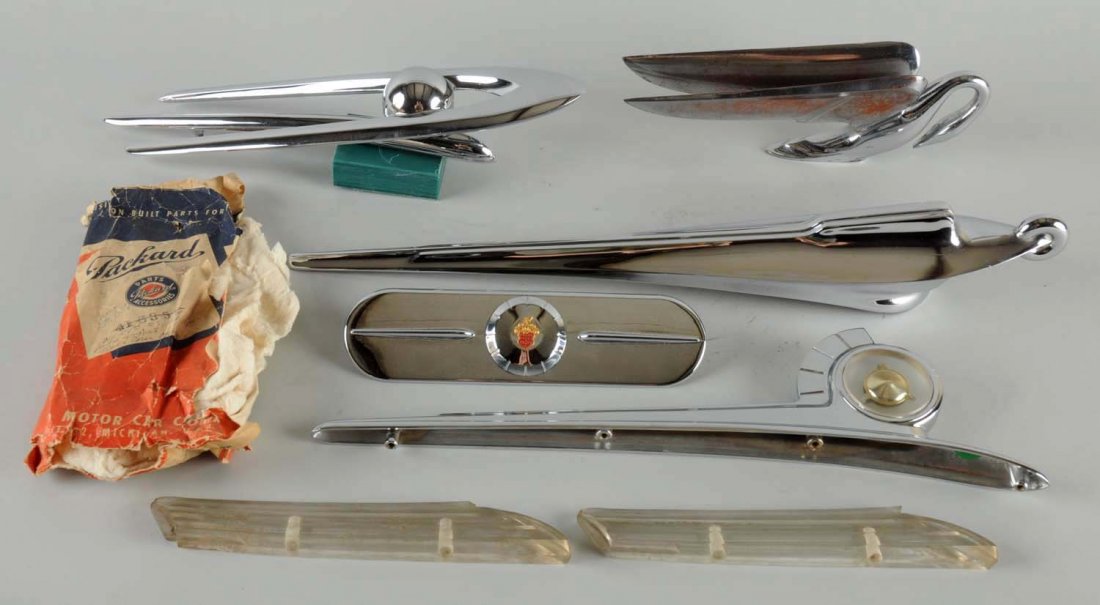 Lot of 5: 1940's & 1950's Packard Hoot Ornaments.: Two are NOS, two are used but in excellent condition. Lot also includes a chrome part that is NIP. (9+). Largest: 21" L.