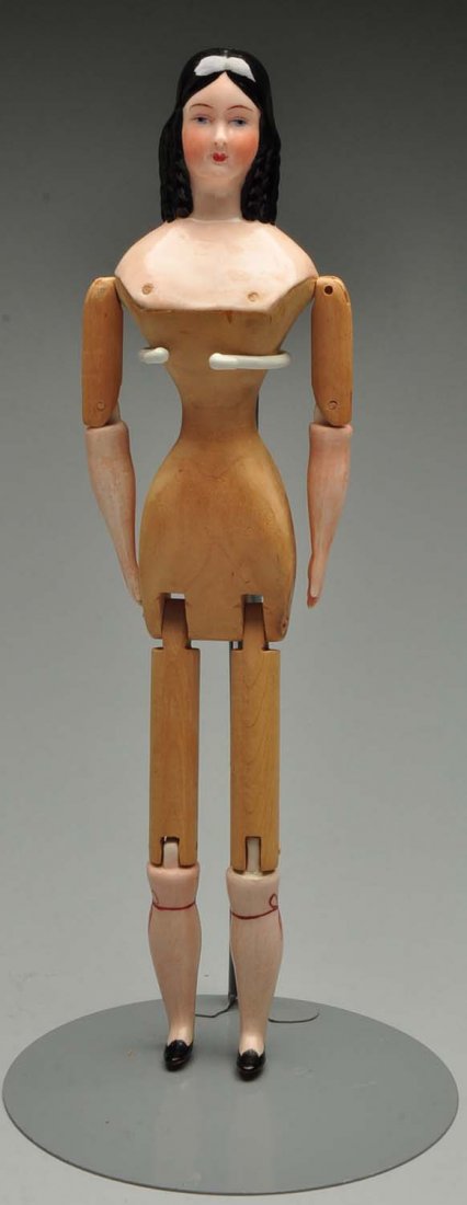 Reproduction Wood Body China: With Jenny Lind hairdo. Approximately 16" tall. Full jointed wood body and china lower limbs.