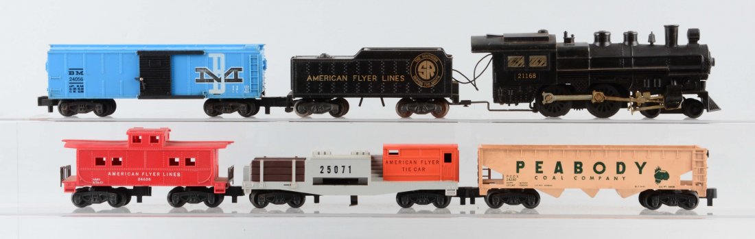 American Flyer 21168 Freight Set.: Includes steam locomotive, 25071 tie ejector car, 25056 boxcar, 24230 Peabody hopper car, and 24636 caboose. Scratches, rust, and wear throughout.