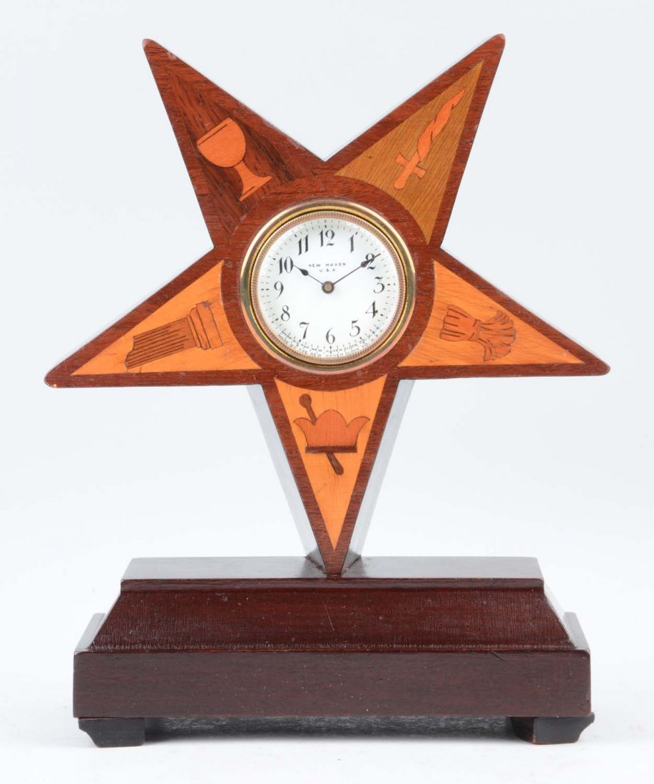 New Haven Order Of The Eastern Star Clock: This lot is of a New Haven Order of the Eastern Star Clock. The body of this clock is comprised of several different woods- some light and some darker, which are also used in the inlay designs on each