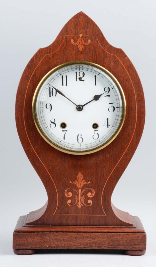 New Haven "Preston" Model Clock: This lot is of a New Haven "Preston" model clock with inlay design. This inlay design can be seen along the edge of clock and with a fleur-de-lie like motive above and underneath the clock’s face. T