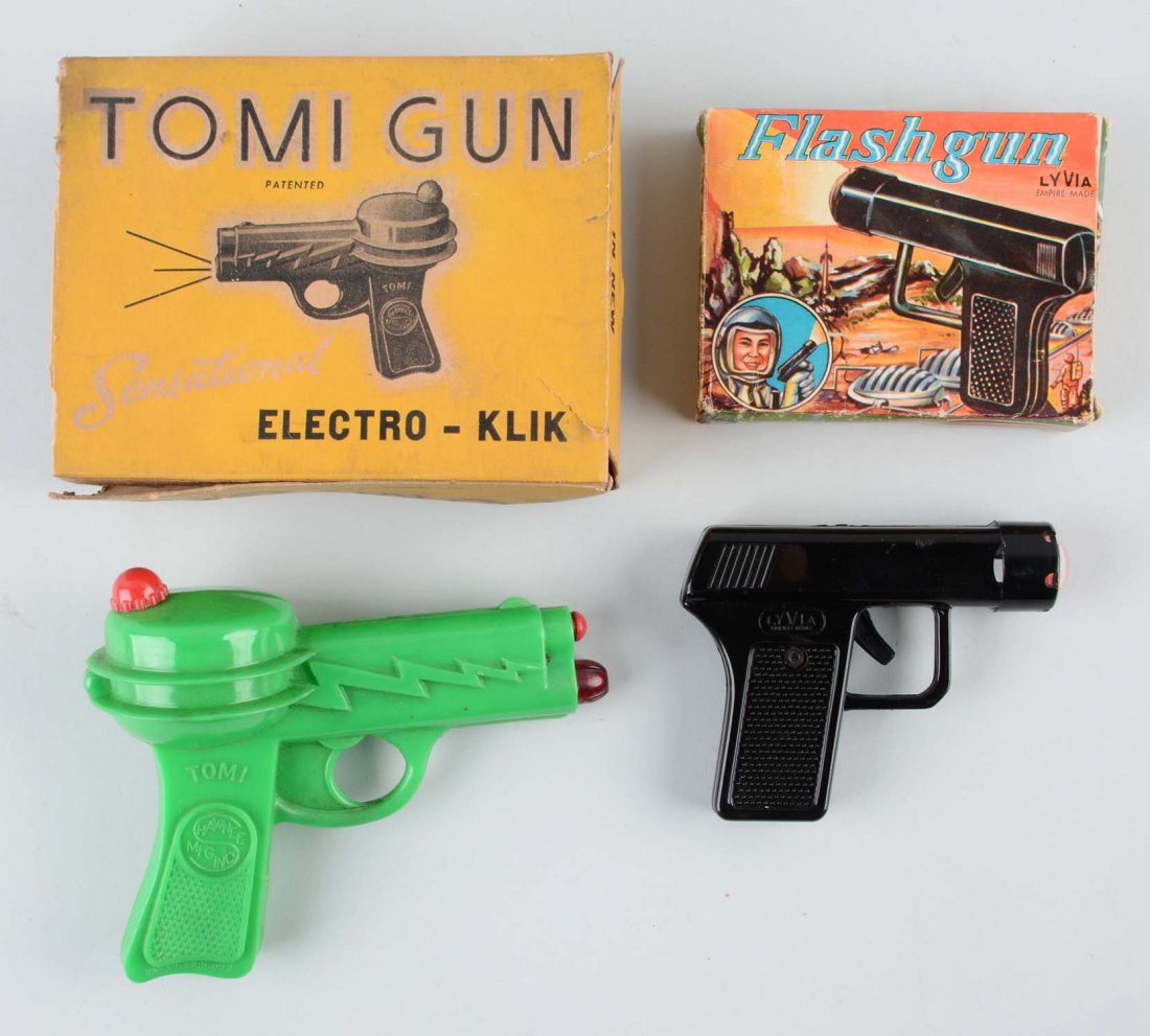 Lot of 2: Vintage Plastic Flashing Ray Guns.: Both have original boxes. One is a Flash Gun, made by Lyvia. Nice graphics on the box. The second one is an unusually shaped Tomi Electro Gun made by Hawnee Mfg Inc. Box on the Tomi Gun has tearing an