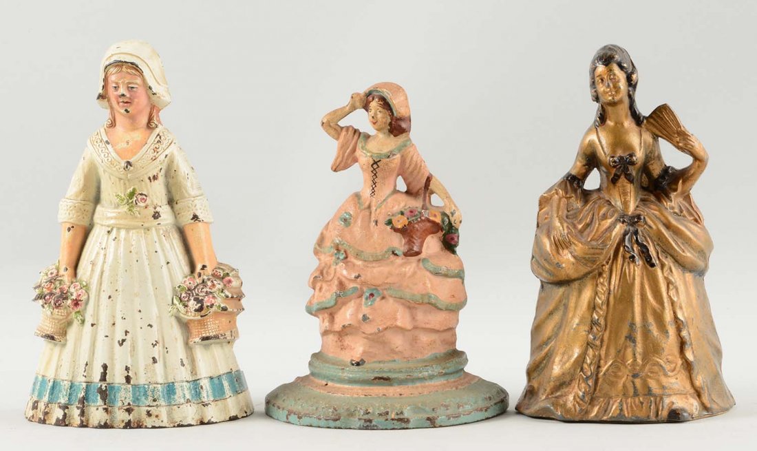 Lot of 3: Cast Iron Assorted Lady Doorstops. (1 of 1)