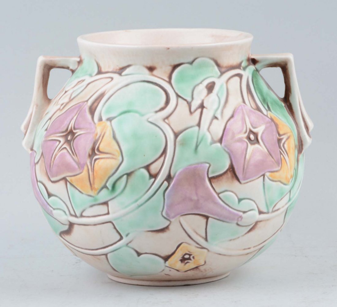 Roseville Morning Glory Vase: This lot is of a Roseville vase from the Morning Glory collection. This collection was first introduced in 1935 with a pattern consisting of open blossoms in white, yellow and lavender colors. the blo