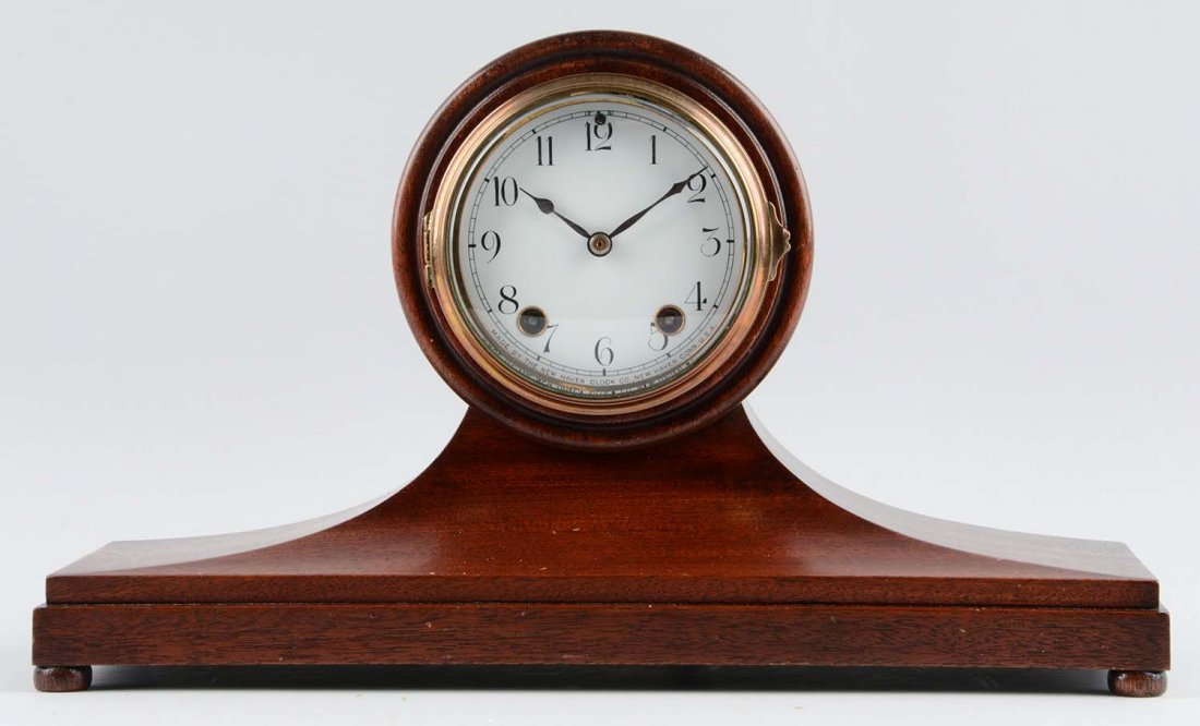 Ansonia Cabinet No 35 Clock.: This lot is of an Ansonia Cabinet No. 35 clock. The body of this clock is comprised of dark wood with a white face and black numbers. There are two key holes on this clock's face, making it a time and