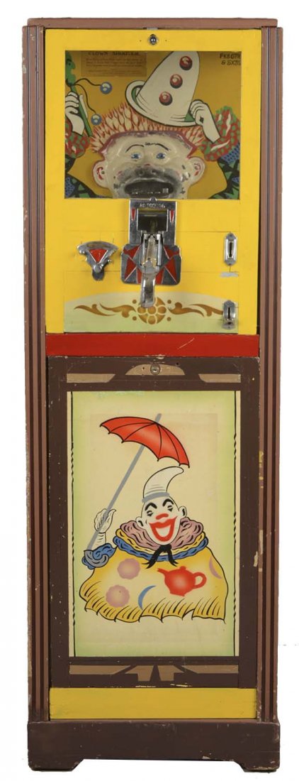 1D Haydon Mfg. Clown Shooter Floor Model Arcade Machine: This machine is designed to offer 5 shots per penny with the object of the game to knock down all of the clown's teeth. Hand painted background is in very good condition with the cast metal face showi