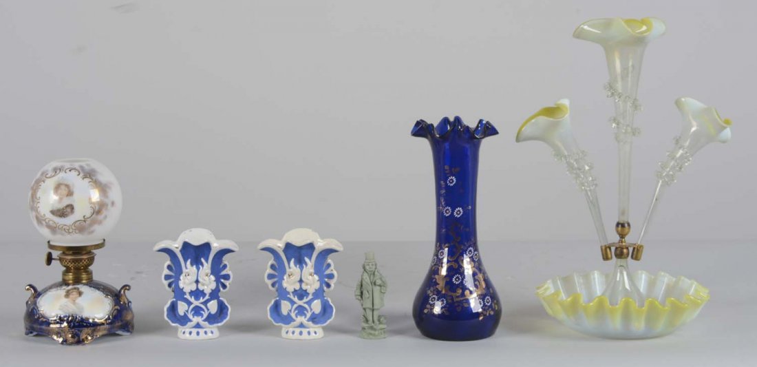 Lot Of 6: Glass and Porcelain Items: Comprised of: 2- Porcelain flower bud vases. White with blue and gold detail. One has been repaired, 5"T. 1- Hand-blown glass epergne. Minor repair has been made, 9"D x 16"T. 1- Cobalt blue glass vase