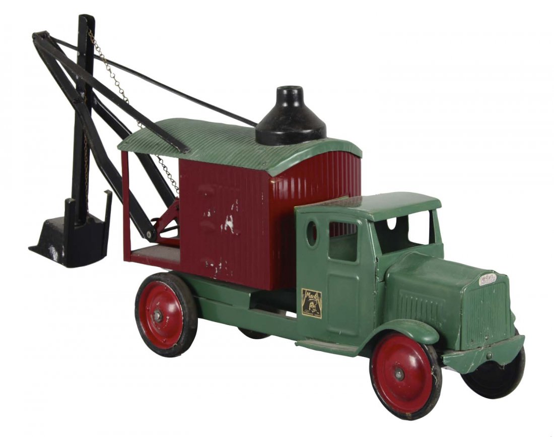 Steel Craft Pressed Steel Steam Shovel Truck: This Mack truck has been fully restored and is fully functioning. It needs cleaning but displays very well. (Excellent). 31"L